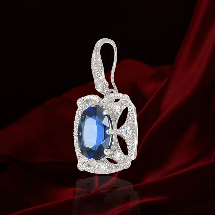 Graceful Blue Sapphire Pendant with Filigree Detail